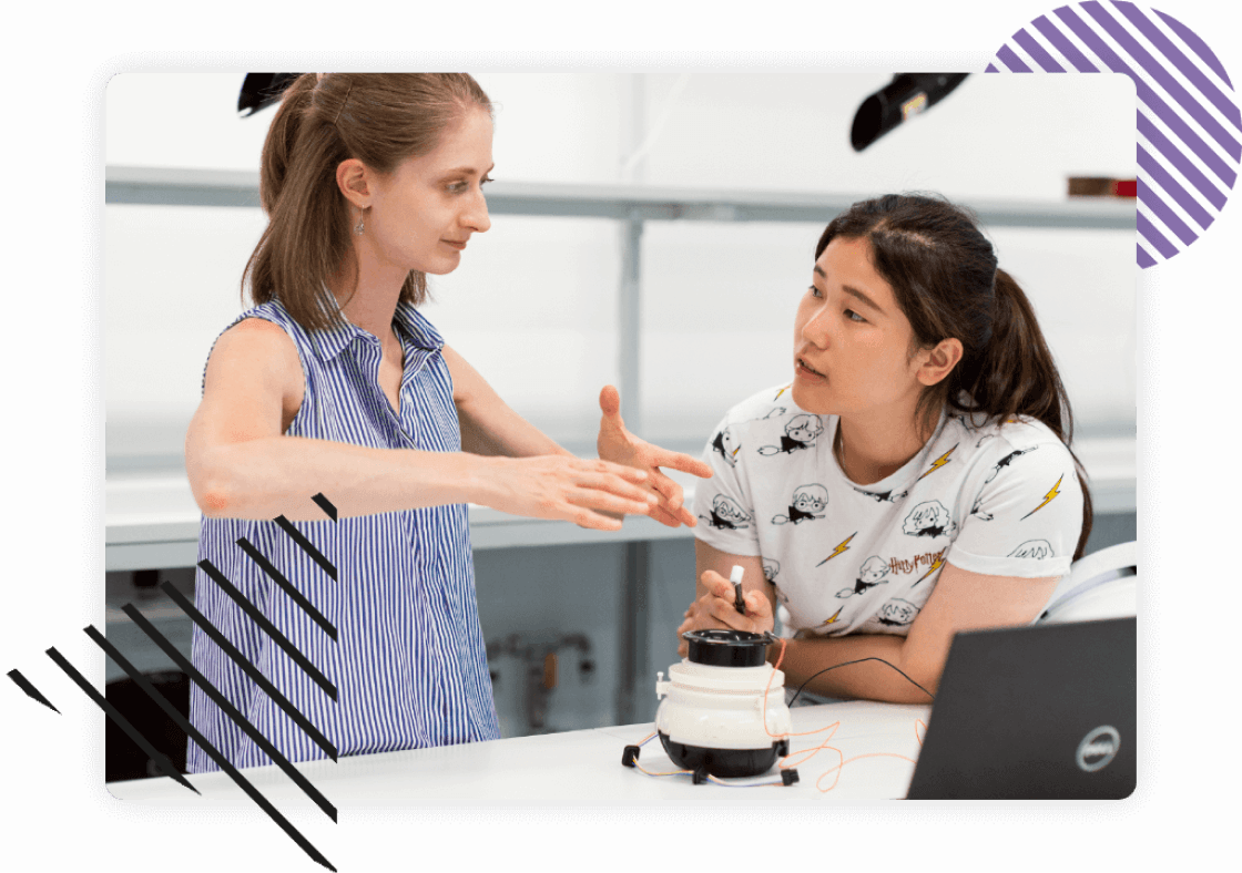 Two women discussing about a tech project